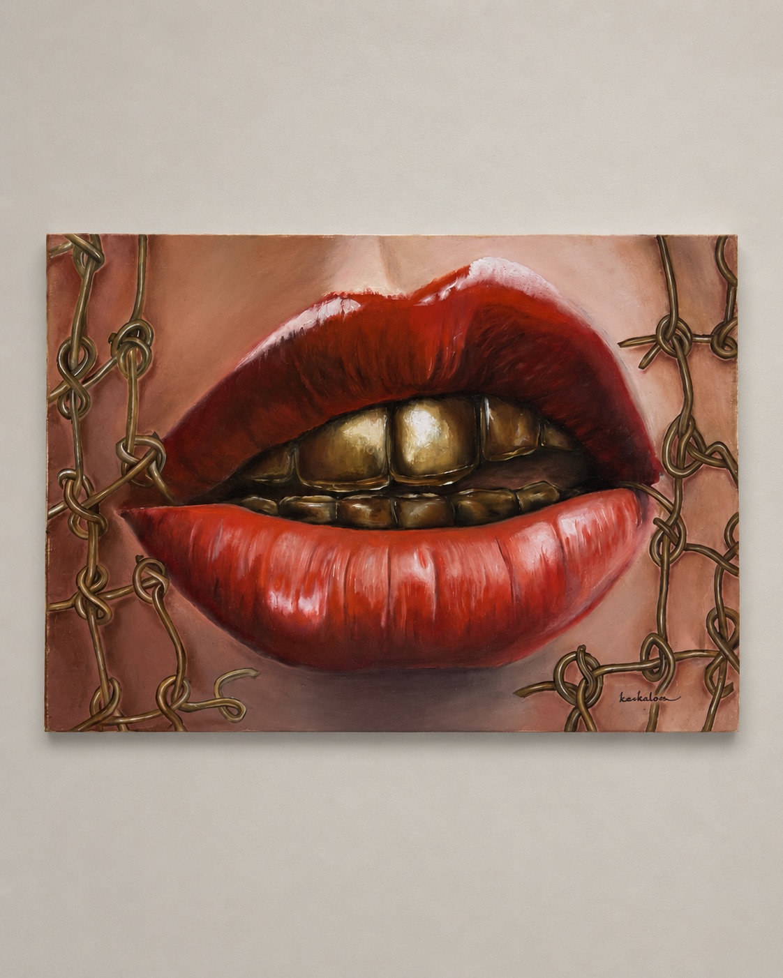Painting of red lips and gold teeth surrounded by knotted wire